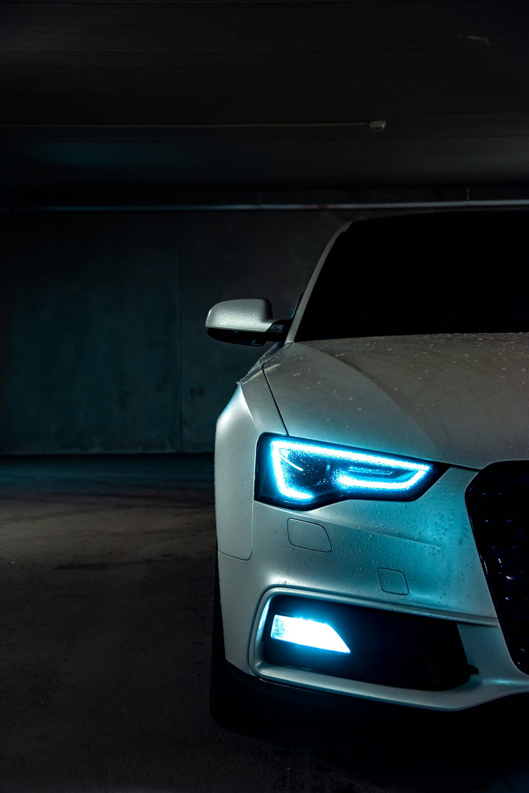 white-vehicle-with-blue-neon-headlight-bulb.jpg white vehicle with blue neon headlight bulb