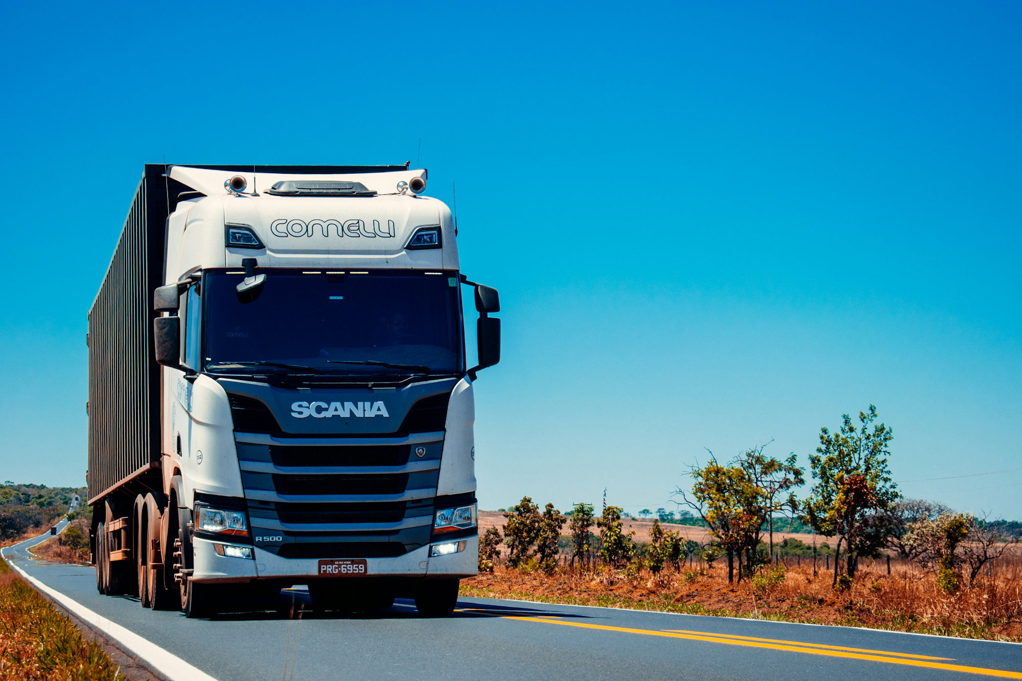 white-truck-on-road-during-daytime.jpg white truck on road during daytime