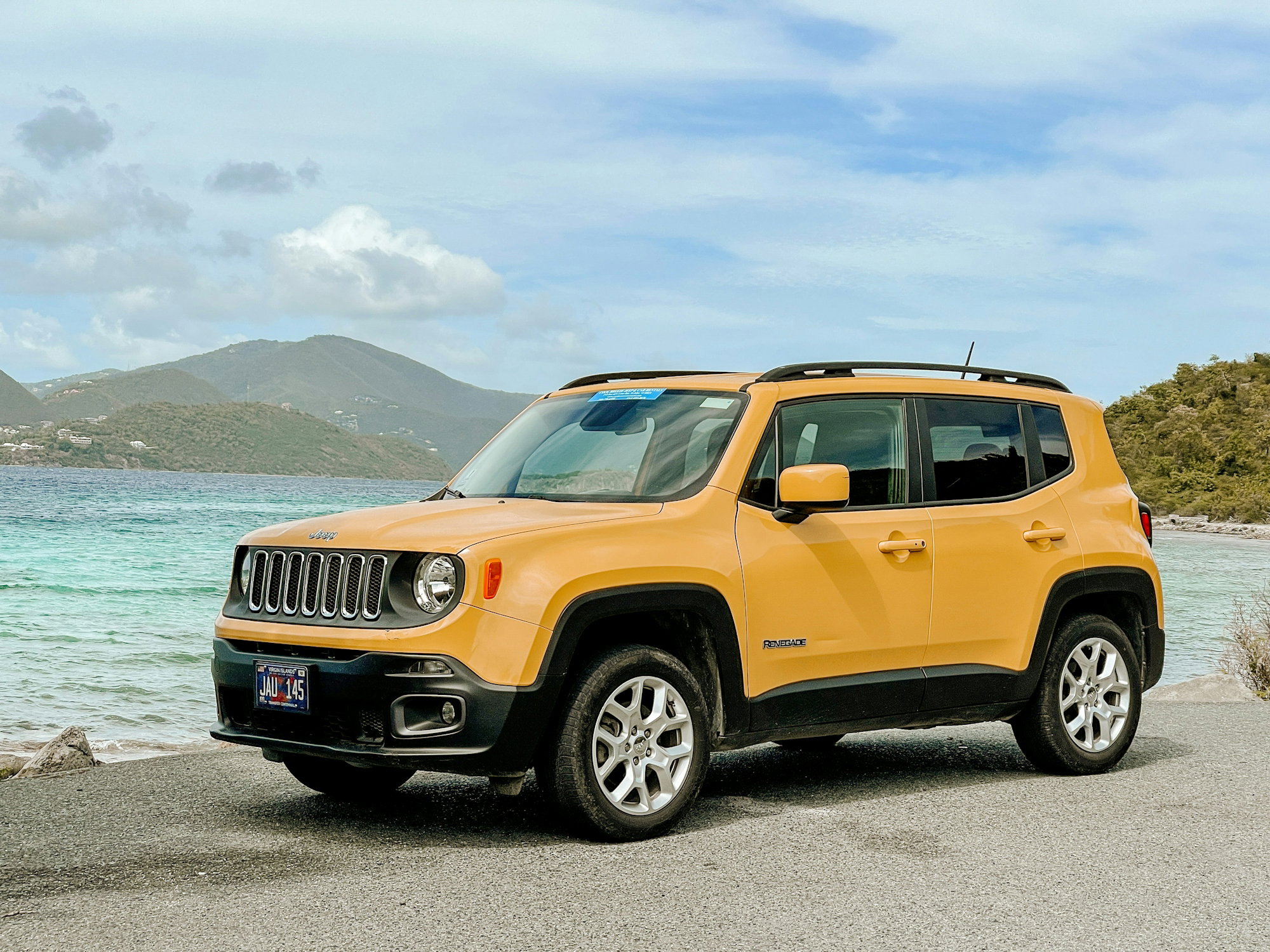 orange-jeep-suv-on-gray-asphalt-road-during-daytime.jpg orange jeep suv on gray asphalt road during daytime